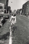 Woman Riding Bike on Brick Street, 11 x 14 Silver Gelatin Photograph