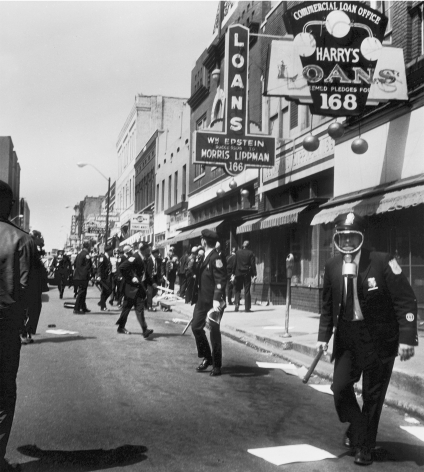 Police converging on marchers with clubs, rifles, and tear gas to stop the looting on Beale and Main Streets, 1968, Archival Pigment Print
