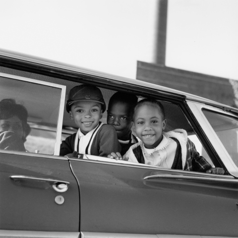 Michael Willis, Harry Williams, and Dwania Kyles sit in the back of a car during the first day of Memphis school integration, 1961, Archival Pigment Print