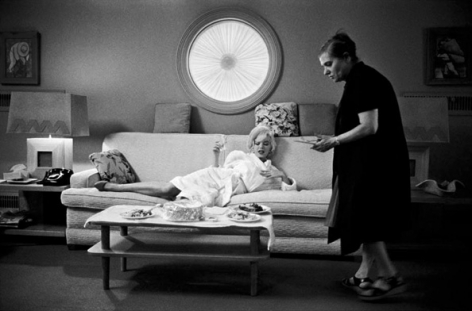Marilyn Monroe (on couch) and Paula Strasberg, May, 1962