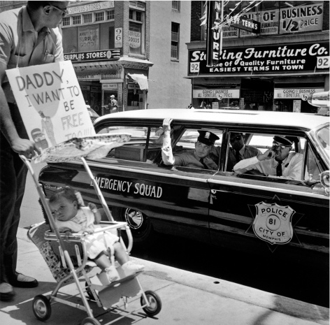 William Edwin Jones pushes daughter Renee Andrewnetta Jones (8 months old) during protest, Main Street, Memphis, Tennessee, ca. 1950&rsquo;s, Archival Pigment Print